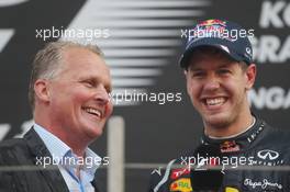 (L to R): Johnny Herbert (GBR) with race winner Sebastian Vettel (GER) Red Bull Racing on the podium. 14.10.2012. Formula 1 World Championship, Rd 16, Korean Grand Prix, Yeongam, South Korea, Race Day.
