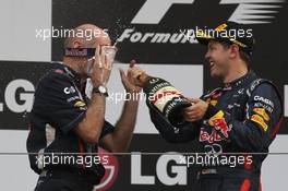 Adrian Newey (GBR) Red Bull Racing Chief Technical Officer with 1st place Sebastian Vettel (GER), Red Bull Racing  14.10.2012. Formula 1 World Championship, Rd 16, Korean Grand Prix, Yeongam, Korea, Race Day