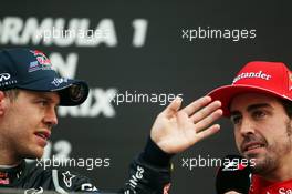 (L to R): Race winner Sebastian Vettel (GER) Red Bull Racing with Fernando Alonso (ESP) Ferrari on the podium. 14.10.2012. Formula 1 World Championship, Rd 16, Korean Grand Prix, Yeongam, South Korea, Race Day.