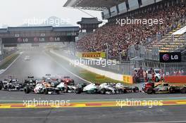 Sergio Perez (MEX) Sauber C31; Jenson Button (GBR) McLaren MP4/27; and Nico Rosberg (GER) Mercedes AMG F1 W03 at the start of the race. 14.10.2012. Formula 1 World Championship, Rd 16, Korean Grand Prix, Yeongam, South Korea, Race Day.