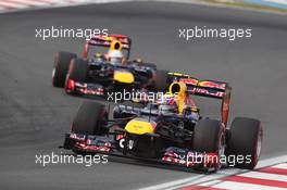 Mark Webber (AUS) Red Bull Racing RB8 leads team mate Sebastian Vettel (GER) Red Bull Racing RB8. 14.10.2012. Formula 1 World Championship, Rd 16, Korean Grand Prix, Yeongam, South Korea, Race Day.