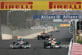 Michael Schumacher (GER), Mercedes GP and Paul di Resta (GBR), Sahara Force India Formula One Team  14.10.2012. Formula 1 World Championship, Rd 16, Korean Grand Prix, Yeongam, Korea, Race Day