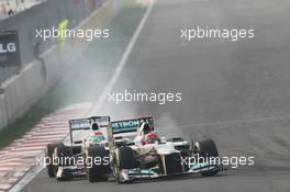 Michael Schumacher (GER) Mercedes AMG F1 W03 leads Sergio Perez (MEX) Sauber C31. 14.10.2012. Formula 1 World Championship, Rd 16, Korean Grand Prix, Yeongam, South Korea, Race Day.