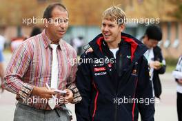 Sebastian Vettel (GER) Red Bull Racing with Kai Ebel (GER) RTL TV Presenter. 13.10.2012. Formula 1 World Championship, Rd 16, Korean Grand Prix, Yeongam, South Korea, Qualifying Day.