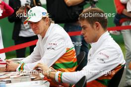 (L to R): Nico Hulkenberg (GER) Sahara Force India F1 and Paul di Resta (GBR) Sahara Force India F1 sign autographs for the fans. 13.10.2012. Formula 1 World Championship, Rd 16, Korean Grand Prix, Yeongam, South Korea, Qualifying Day.