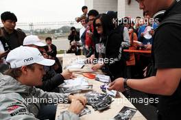 Nico Rosberg (GER) Mercedes AMG F1 signs autographs for the fans. 13.10.2012. Formula 1 World Championship, Rd 16, Korean Grand Prix, Yeongam, South Korea, Qualifying Day.