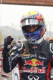 Mark Webber (AUS) Red Bull Racing celebrates his pole position in parc ferme. 13.10.2012. Formula 1 World Championship, Rd 16, Korean Grand Prix, Yeongam, South Korea, Qualifying Day.