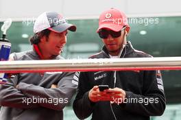 (L to R): Sergio Perez (MEX) Sauber with Lewis Hamilton (GBR) McLaren on the drivers parade. 14.10.2012. Formula 1 World Championship, Rd 16, Korean Grand Prix, Yeongam, South Korea, Race Day.