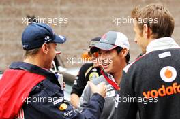 (L to R): Sebastian Vettel (GER) Red Bull Racing with Kamui Kobayashi (JPN) Sauber and Jenson Button (GBR) McLaren. 14.10.2012. Formula 1 World Championship, Rd 16, Korean Grand Prix, Yeongam, South Korea, Race Day.