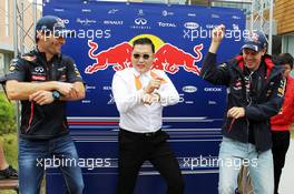Psy (KOR) Rapper performs his dance for his global hit song Gangnam Style with Mark Webber (AUS) Red Bull Racing (Left) and Sebastian Vettel (GER) Red Bull Racing (Right). 14.10.2012. Formula 1 World Championship, Rd 16, Korean Grand Prix, Yeongam, South Korea, Race Day.