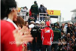 Fernando Alonso (ESP) Ferrari and the other drivers head to the parade. 14.10.2012. Formula 1 World Championship, Rd 16, Korean Grand Prix, Yeongam, South Korea, Race Day.