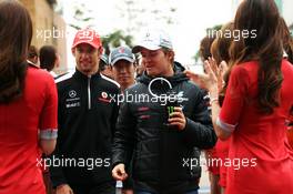 (L to R): Jenson Button (GBR) McLaren with Nico Rosberg (GER) Mercedes AMG F1 on the drivers parade. 14.10.2012. Formula 1 World Championship, Rd 16, Korean Grand Prix, Yeongam, South Korea, Race Day.