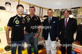 (L to R): Romain Grosjean (FRA) Lotus F1 Team with Eric Boullier (FRA) Lotus F1 Team Principal and Ion Bazac, Owner of Lotus Shop Franchise at the opening of the Lotus shop. 25.05.2012. Formula 1 World Championship, Rd 6, Monaco Grand Prix, Monte Carlo, Monaco, Friday