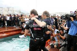 Race winner Mark Webber (AUS) Red Bull Racing celebrates with Christian Horner (GBR) Red Bull Racing Team Principal, Mark Thompson (GBR) Getty Images Photographer and the team on the Red Bull Energy Station. 27.05.2012. Formula 1 World Championship, Rd 6, Monaco Grand Prix, Monte Carlo, Monaco, Race Day