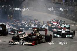 Kimi Raikkonen (FIN) Lotus F1 E20 at the start of the race as Romain Grosjean (FRA) Lotus F1 E20 and Kamui Kobayashi (JPN) Sauber C31 crash. 27.05.2012. Formula 1 World Championship, Rd 6, Monaco Grand Prix, Monte Carlo, Monaco, Race Day