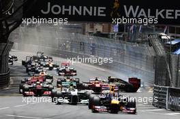 Mark Webber (AUS) Red Bull Racing RB8 leads at the start of the race as Romain Grosjean (FRA) Lotus F1 E20 crashes. 27.05.2012. Formula 1 World Championship, Rd 6, Monaco Grand Prix, Monte Carlo, Monaco, Race Day