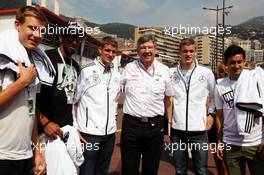 The German National Football Team in the F1 pits meet Ross Brawn (GBR) Mercedes AMG F1 Team Principal. 27.05.2012. Formula 1 World Championship, Rd 6, Monaco Grand Prix, Monte Carlo, Monaco, Race Day