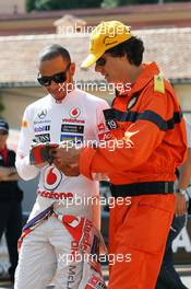 Lewis Hamilton (GBR) McLaren signs autographs for the fans. 24.05.2012. Formula 1 World Championship, Rd 6, Monaco Grand Prix, Monte Carlo, Monaco, Practice Day