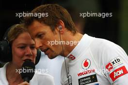 Jenson Button (GBR) McLaren with Jenny Gow (GBR) BBC Radio 5 Live Pitlane Reporter. 24.05.2012. Formula 1 World Championship, Rd 6, Monaco Grand Prix, Monte Carlo, Monaco, Practice Day