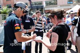 Daniel Ricciardo (AUS) Scuderia Toro Rosso signs autographs for the fans. 23.05.2012. Formula 1 World Championship, Rd 6, Monaco Grand Prix, Monte Carlo, Monaco, Preparation Day