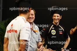 (L to R): Jenson Button (GBR) McLaren; Paul Hembery (GBR) Pirelli Motorsport Director and Romain Grosjean (FRA) Lotus F1 Team at a Pirelli cooking competition. 23.05.2012. Formula 1 World Championship, Rd 6, Monaco Grand Prix, Monte Carlo, Monaco, Preparation Day
