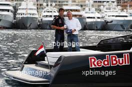(L to R): Mark Webber (AUS) Red Bull Racing with Kai-Christian Helms (GER) Casio European Marketing Manager and the Casio Edifice EFR-520RB Red Bull Racing Limited Edition watch. 23.05.2012. Formula 1 World Championship, Rd 6, Monaco Grand Prix, Monte Carlo, Monaco, Preparation Day