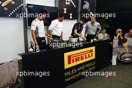 (L to R): Jenson Button (GBR) McLaren; Romain Grosjean (FRA) Lotus F1 Team and Paul Hembery (GBR) Pirelli Motorsport Director at a Pirelli cooking competition. 23.05.2012. Formula 1 World Championship, Rd 6, Monaco Grand Prix, Monte Carlo, Monaco, Preparation Day