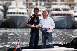 (L to R): Mark Webber (AUS) Red Bull Racing with Kai-Christian Helms (GER) Casio European Marketing Manager and the Casio Edifice EFR-520RB Red Bull Racing Limited Edition watch. 23.05.2012. Formula 1 World Championship, Rd 6, Monaco Grand Prix, Monte Carlo, Monaco, Preparation Day
