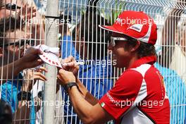 Fernando Alonso (ESP) Ferrari signs autographs for the fans. 23.05.2012. Formula 1 World Championship, Rd 6, Monaco Grand Prix, Monte Carlo, Monaco, Preparation Day