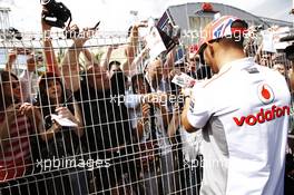 Lewis Hamilton (GBR) McLaren signs autographs for the fans. 23.05.2012. Formula 1 World Championship, Rd 6, Monaco Grand Prix, Monte Carlo, Monaco, Preparation Day