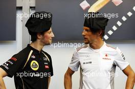 (L to R): Romain Grosjean (FRA) Lotus F1 Team and Jenson Button (GBR) McLaren at a Pirelli cooking competition. 23.05.2012. Formula 1 World Championship, Rd 6, Monaco Grand Prix, Monte Carlo, Monaco, Preparation Day
