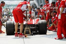 Fernando Alonso (ESP) Ferrari F2012 makes a pit stop.  23.03.2012. Formula 1 World Championship, Rd 2, Malaysian Grand Prix, Sepang, Malaysia, Friday Practice