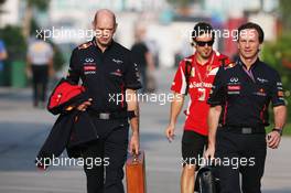 (L to R): Adrian Newey (GBR) Red Bull Racing Chief Technical Officer with Christian Horner (GBR) Red Bull Racing Team Principal and Fernando Alonso (ESP) Ferrari in the background.  23.03.2012. Formula 1 World Championship, Rd 2, Malaysian Grand Prix, Sepang, Malaysia, Friday