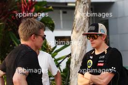 (L to R): Mika Salo (FIN) talks with Kimi Raikkonen (FIN) Lotus F1 Team. 23.03.2012. Formula 1 World Championship, Rd 2, Malaysian Grand Prix, Sepang, Malaysia, Friday