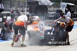 Paul di Resta (GBR) Sahara Force India VJM05 returns to the pits with his rear brake on fire. 23.03.2012. Formula 1 World Championship, Rd 2, Malaysian Grand Prix, Sepang, Malaysia, Friday Practice