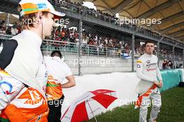 (L to R): Nico Hulkenberg (GER) Sahara Force India F1 and Paul di Resta (GBR) Sahara Force India F1 on the grid. 25.03.2012. Formula 1 World Championship, Rd 2, Malaysian Grand Prix, Sepang, Malaysia, Sunday Pre-Race Grid