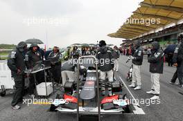 Kamui Kobayashi (JPN) Sauber C31 on the grid. 25.03.2012. Formula 1 World Championship, Rd 2, Malaysian Grand Prix, Sepang, Malaysia, Sunday Pre-Race Grid
