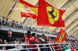 Ferrari fans with flags. 25.03.2012. Formula 1 World Championship, Rd 2, Malaysian Grand Prix, Sepang, Malaysia, Sunday Pre-Race Grid