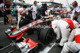 Lewis Hamilton (GBR) McLaren MP4/27 on the grid. 25.03.2012. Formula 1 World Championship, Rd 2, Malaysian Grand Prix, Sepang, Malaysia, Sunday Pre-Race Grid