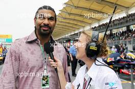 (L to R): David Haye (GBR) Retired Boxer  with Jenny Gow (GBR) BBC Radio 5 Live Pitlane Reporter on the grid. 25.03.2012. Formula 1 World Championship, Rd 2, Malaysian Grand Prix, Sepang, Malaysia, Sunday Pre-Race Grid