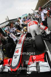 Lewis Hamilton (GBR) McLaren MP4/27 on the grid. 25.03.2012. Formula 1 World Championship, Rd 2, Malaysian Grand Prix, Sepang, Malaysia, Sunday Pre-Race Grid