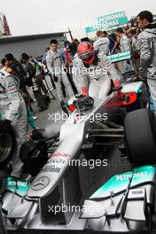 Michael Schumacher (GER) Mercedes AMG F1 W03 on the grid. 25.03.2012. Formula 1 World Championship, Rd 2, Malaysian Grand Prix, Sepang, Malaysia, Sunday Pre-Race Grid