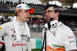 (L to R): Nico Hulkenberg (GER) Sahara Force India F1 talks with Bradley Joyce (GBR) Sahara Force India F1 Race Engineer on the grid. 25.03.2012. Formula 1 World Championship, Rd 2, Malaysian Grand Prix, Sepang, Malaysia, Sunday Pre-Race Grid