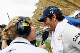 Mark Webber (AUS) Red Bull Racing interviewed by Jenny Gow (GBR) BBC Radio 5 Live Pitlane Reporter on the grid. 25.03.2012. Formula 1 World Championship, Rd 2, Malaysian Grand Prix, Sepang, Malaysia, Sunday Pre-Race Grid