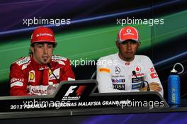 (L to R): Fernando Alonso (ESP) Ferrari and Lewis Hamilton (GBR) McLaren in the FIA Press Conference. 25.03.2012. Formula 1 World Championship, Rd 2, Malaysian Grand Prix, Sepang, Malaysia, Sunday Podium