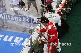 Race winner Fernando Alonso (ESP) Ferrari and second placed Sergio Perez (MEX) Sauber C31 celebrate on the podium. 25.03.2012. Formula 1 World Championship, Rd 2, Malaysian Grand Prix, Sepang, Malaysia, Sunday Podium
