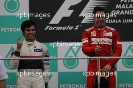 2nd place Sergio Perez (MEX), Sauber F1 Team and Fernando Alonso (ESP), Scuderia Ferrari  25.03.2012. Formula 1 World Championship, Rd 2, Malaysian Grand Prix, Sepang, Malaysia, Sunday Podium