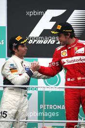 Sergio Perez (MEX), Sauber F1 Team and Fernando Alonso (ESP), Scuderia Ferrari  25.03.2012. Formula 1 World Championship, Rd 2, Malaysian Grand Prix, Sepang, Malaysia, Sunday Podium