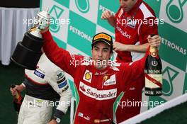 Race winner Fernando Alonso (ESP) Ferrari celebrates on the podium. 25.03.2012. Formula 1 World Championship, Rd 2, Malaysian Grand Prix, Sepang, Malaysia, Sunday Podium