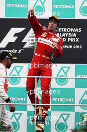 Race winner Fernando Alonso (ESP) Ferrari celebrates on the podium. 25.03.2012. Formula 1 World Championship, Rd 2, Malaysian Grand Prix, Sepang, Malaysia, Sunday Podium